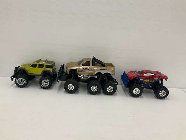 Three Radio Controlled Monster Trucks... no controllers image