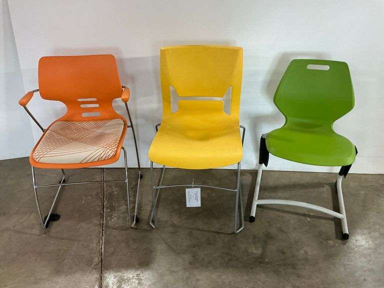 Three Stackable Chairs - Orange, Yellow, and Green image