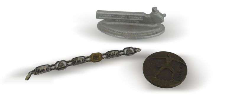 Industrial Advertising Paperweight, 1933-1934 Century of Progress Elephant Design Bracelet, and a Century of Progress Commemorative image