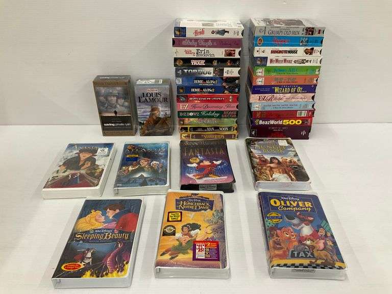 Group of VHS Tapes Including Disney and Family Films image