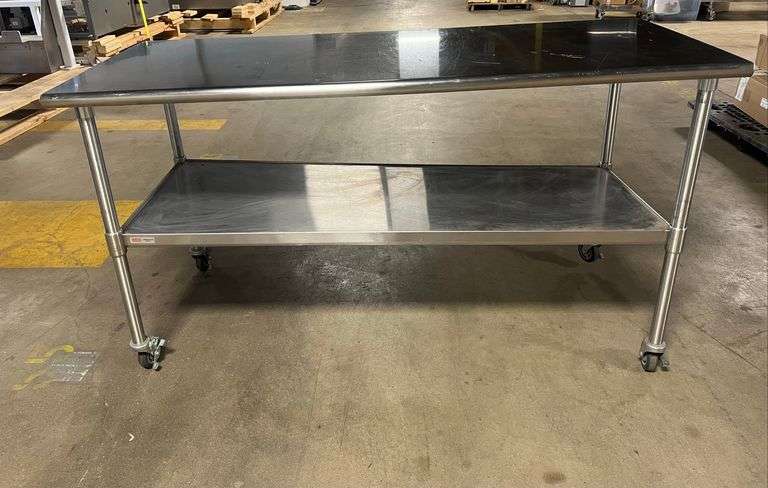 Stainless Steel Rolling Table ... 38 x 72 x 30 in.... One leg is bent, making the table uneven. SEE PHOTOS image