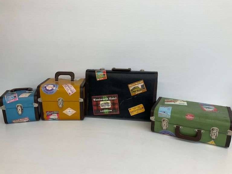 Set of Four Decorative Suitcases with Travel Stickers image