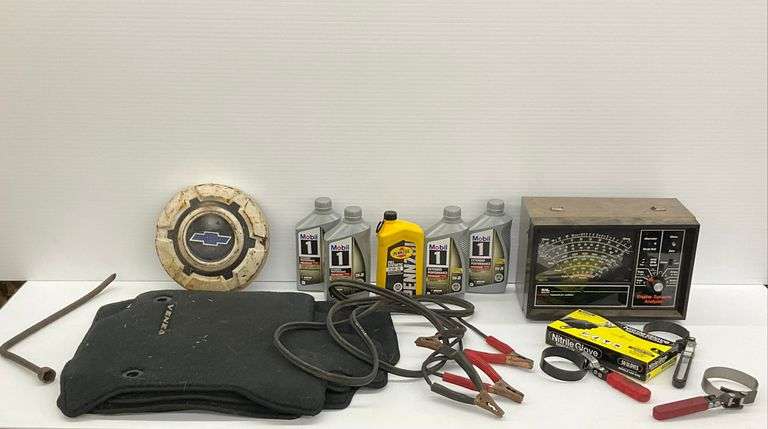 Automotive Diagnostic Analyzer, Chevrolet Hubcap, and Car Care Supplies image
