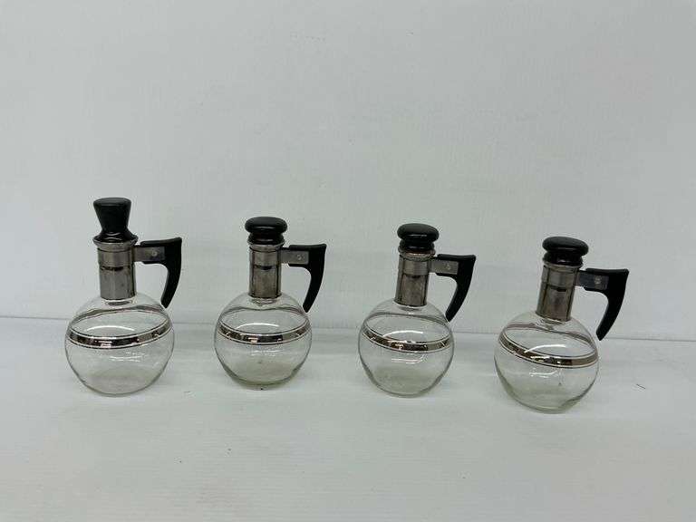 Four Glass Syrup Dispensers with Bakelite Handles image