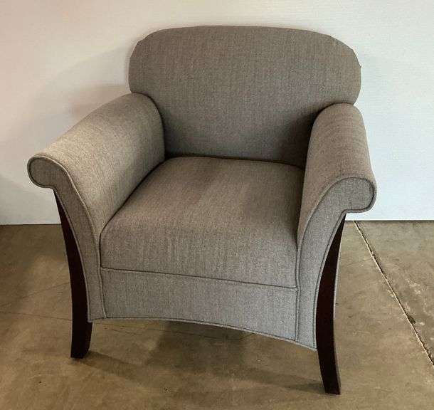 Upholstered Armchair with Curved Back and Dark Wood Legs image