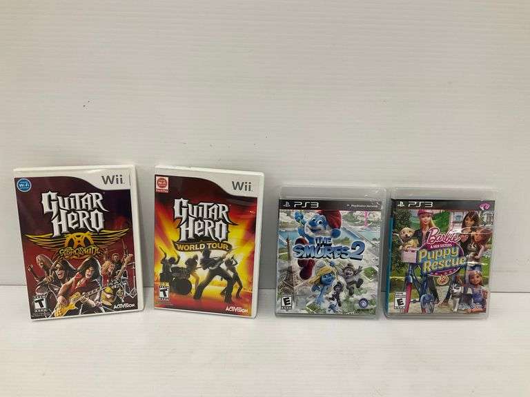 Wii & PS3 Games - Guitar Hero, Smurfs 2, Barbie Puppy Rescue image