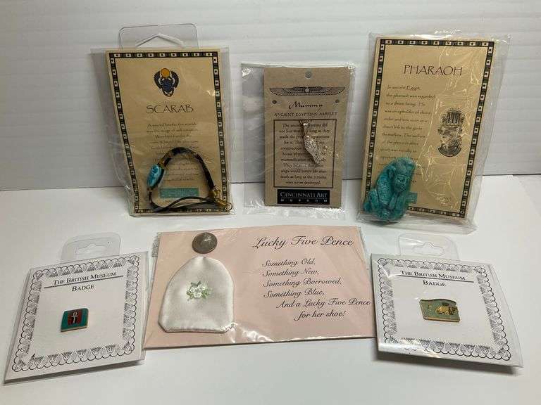 Collection of Museum Souvenirs: Egyptian Amulets, Scarab Bracelet, British Museum Badges, Lucky Five Pence image