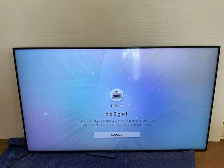 Samsung 65 in. QLED Smart TV... no remote or stand, powers on image
