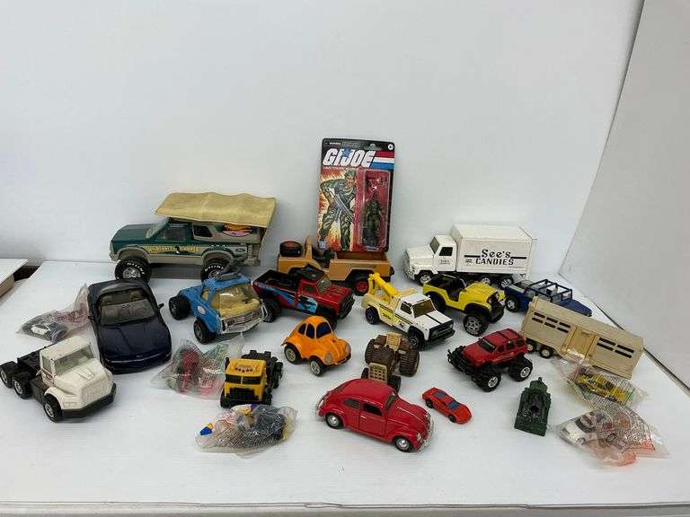 Variety of Diecast Vehicles and GI Joe Figure image