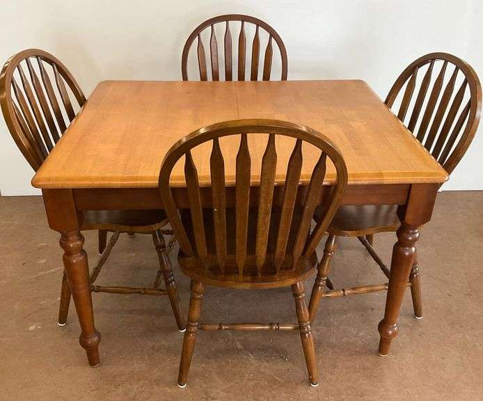 Wooden Dining Table with Four Chairs image