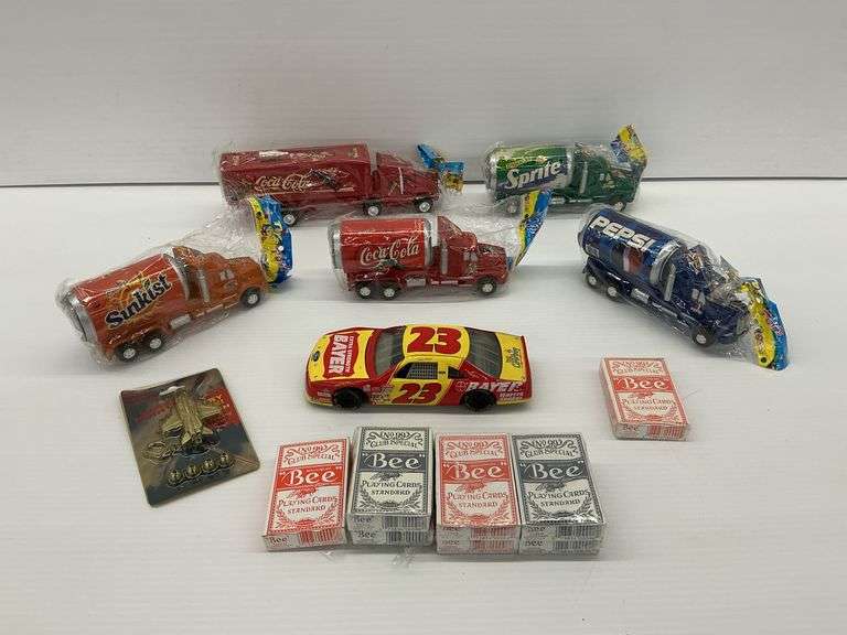 Assorted Collectibles: Soda Can Trucks, Race Car, Playing Cards, Airplane Keychain image