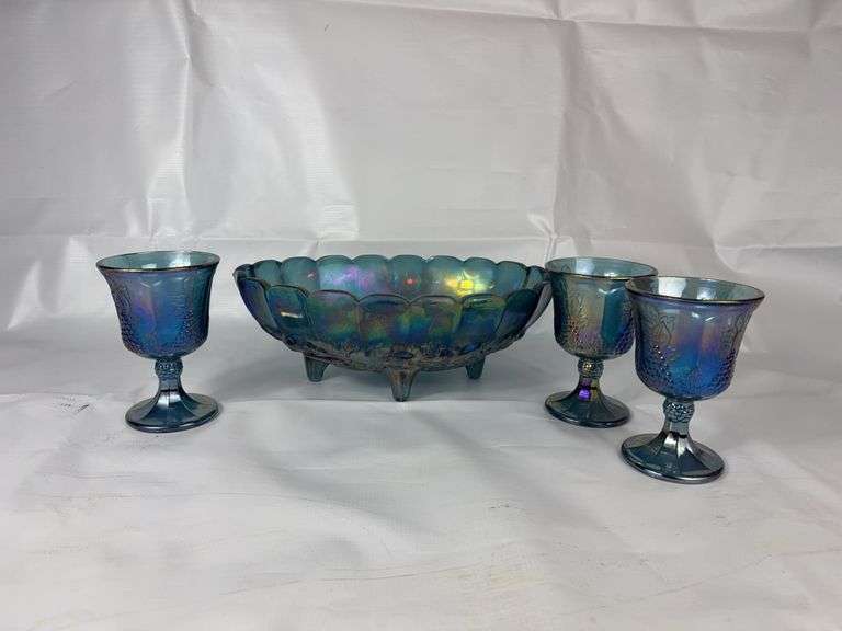 Blue carnival glass punch bowl and goblets