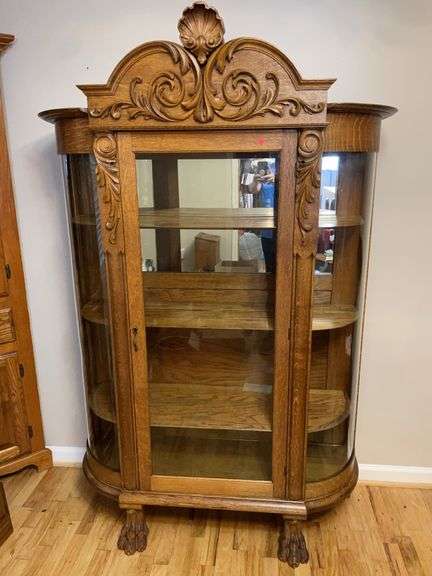 Oak curio cabinet with claw feet image