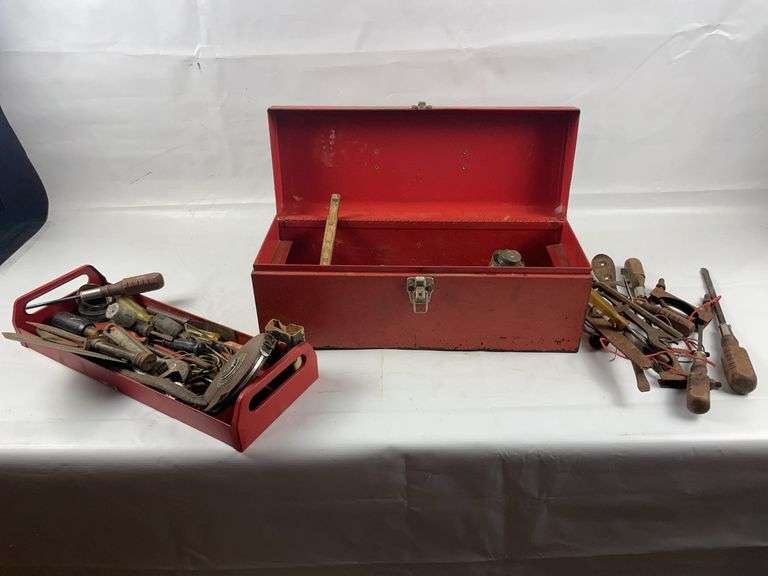 Old red tool box with vintage tools image