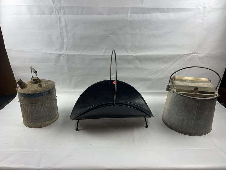 Vintage gas can, mop bucket and log holder image