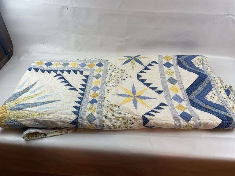 Blue white and yellow quilt image