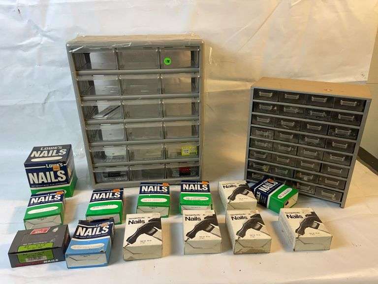 2 drawer organizers and boxes of nails image