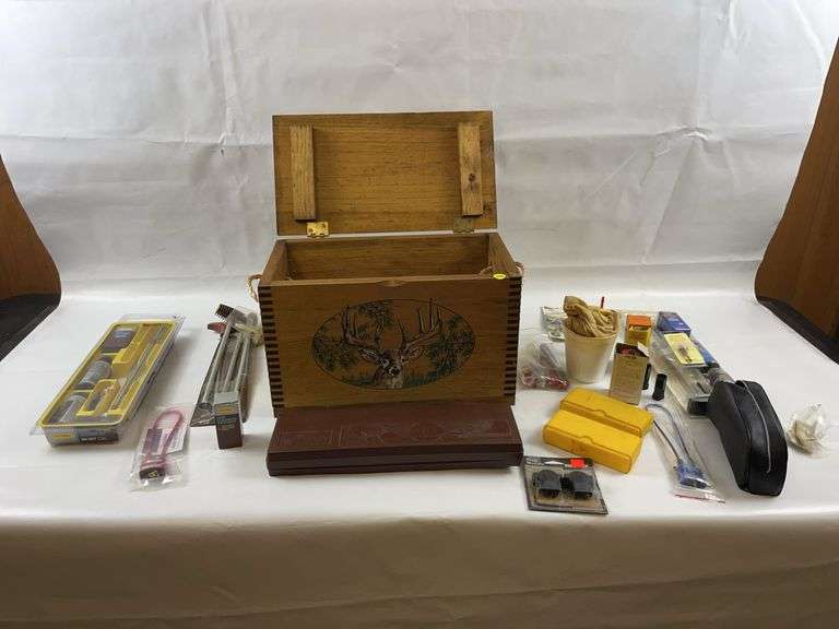 Gun cleaning supplies and wooden box image