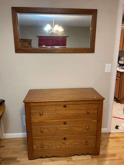 Oak dresser with hanging mirror image