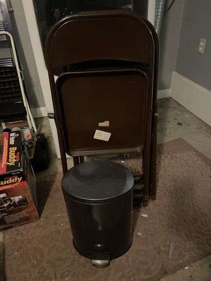 5 metal fold up chairs and metal trash can image