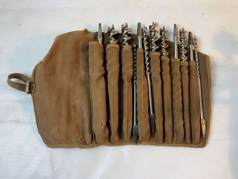 Vintage wooden handheld drill and bits image