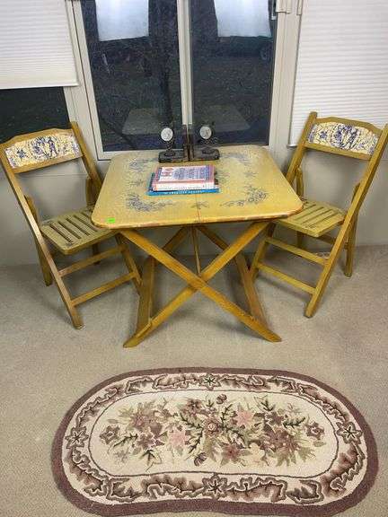 Wooden Table with two wooden chairs and contents image
