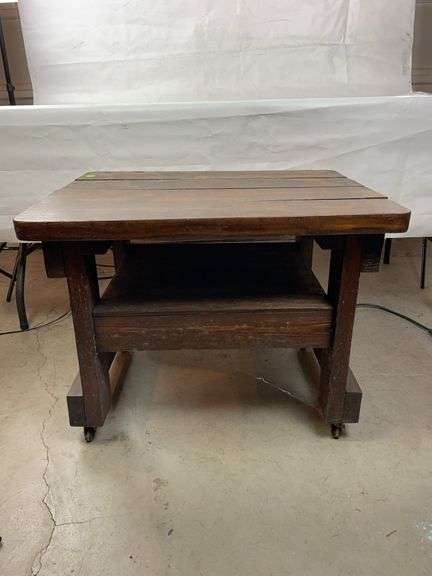 Wooden table on casters image