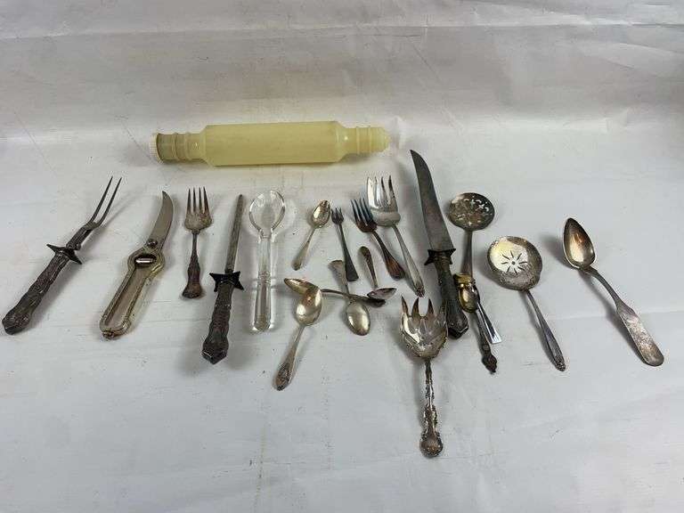 Vintage rolling pin and silverware image