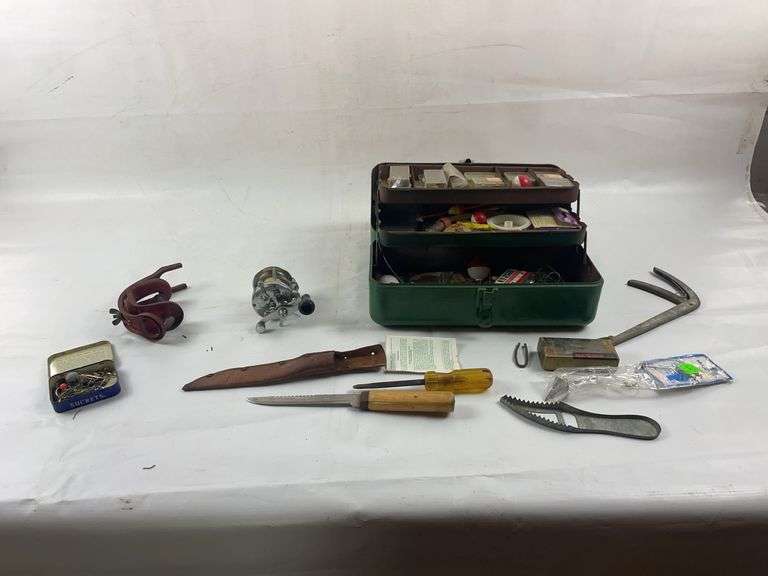 Vintage fishing reel and tackle box image