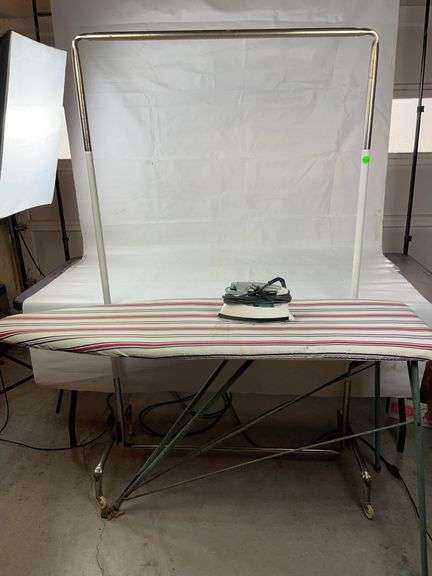 Rolling clothes rack, ironing board and iron image