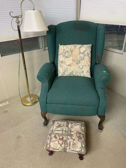 Green wingback chair, floor lamp and foot stool image