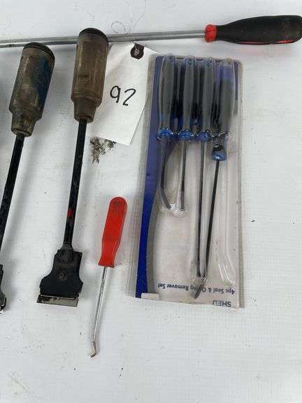 Scrapers, picks, retaining clip removers