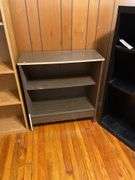 Three Shelf Units: Wooden, Particle Board, and Metal
