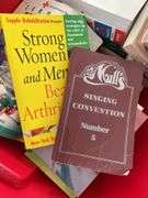 Collection of Books in Red Tote