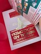 Collection of Books in Red Tote