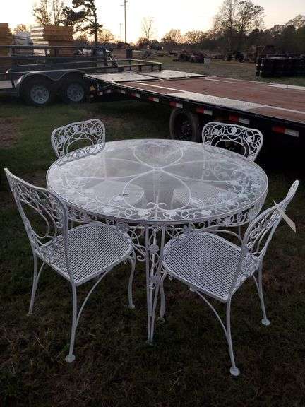 Vintage wrought iron patio furniture- glass tabletop and 4 chairs image