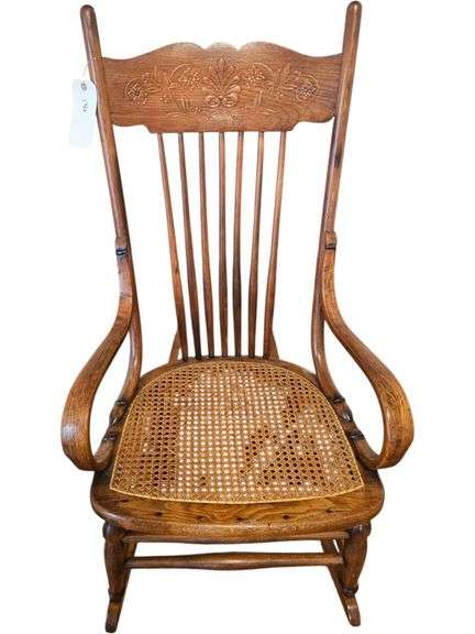 Antique Oak Rocking Chair with Cane Seat and Carved Back image
