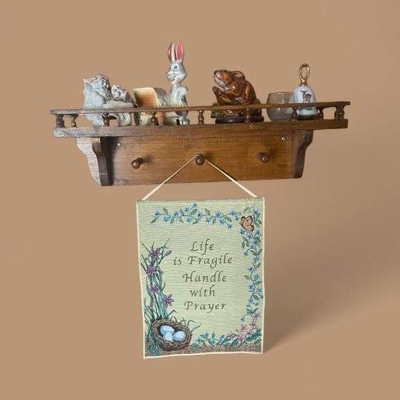 Wood shelf with figurines and tapestry image