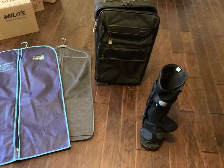 Suitcase, Two Suit Bags, and Walking Boot image