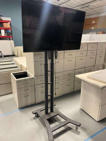 TCL 43" Flat Screen TV on Portable Stand (Roku TV is Printed on TV)