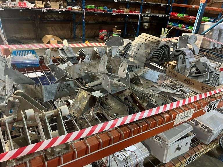 Contents of Shelf - Various Brackets & Pipe Mounts for Irrigation System image