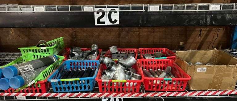 Contents of Shelf - Tee Fittings, Couplers, 12" Steel Nipples, Elbows (Male x Female) 2 1/2"x3" Nipples & Containers image