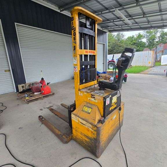 Big. Joe Pallet Stacker | Max Weight Capacity: 3,000 lbs. | 2 Stage Mast | 130" Lift Height | 44" Forks | Batteries Need Replacing | Runs Well While Plugged To Charger