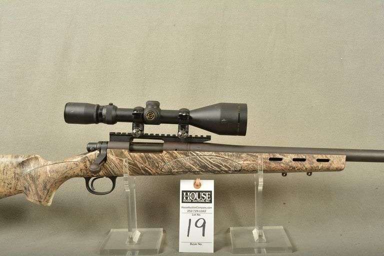 REMINGTON Model 700 Rifle, cal. .22-250 Bolt Action with SIMMONS Scope 2.5-10x50 WA, factory camo composite stock, 26" barrel, mint condition, Ser #G6800009 image