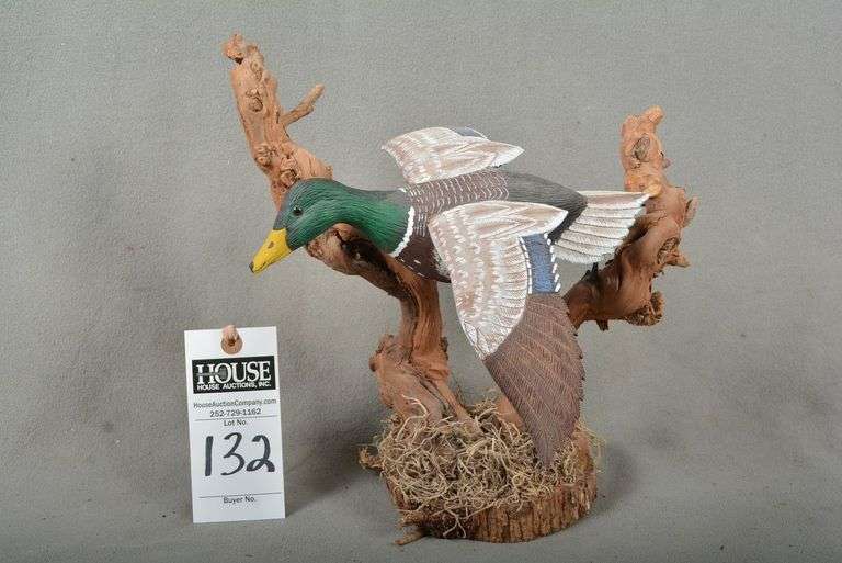 Mallard drake in flight, on driftwood, by unknown maker image