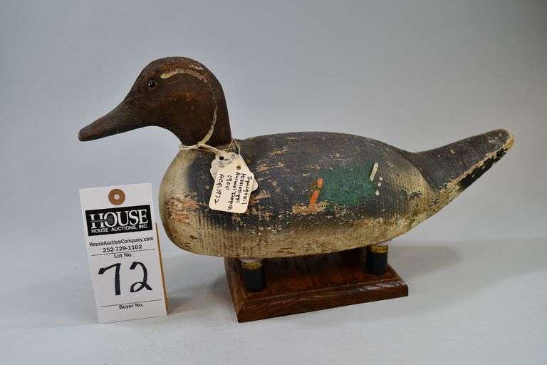 Pintail, drake, Carver: Animal Trap decoy company, Pascagoula, MS. The Animal Trap Company of North America (ATCNA) produced hunting decoys for a greater number of years than any other decoy factory. This decoy has two paper tags from previous owners that say: "Sprigtail, Mississippi, Animal Trap Co., c. 1900, aquired 1972." The other tag says: "Mississippi, Animal Trap Co, Machine Decoy, 1900." Bottom is stamped: "Animal Trap Company of Miss, Pascagoula, Miss." There are two rust rings on the bottom from old hunting weights. image