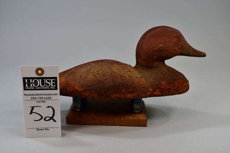Redhead, drake, Cast iron, sinkbox wing decoy. This iron decoy is painted like a redhead and has some active rust happening. image