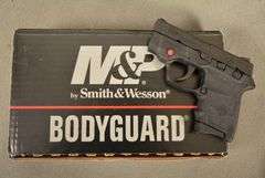 SMITH & WESSON Model M&P BODYGUARD, New in original factory case with CRIMSON TRACE SIGHTS and two magazines, Cal. .380 Auto Semi-Auto Handgun, 2.75" barrel, Ser #KEE4883