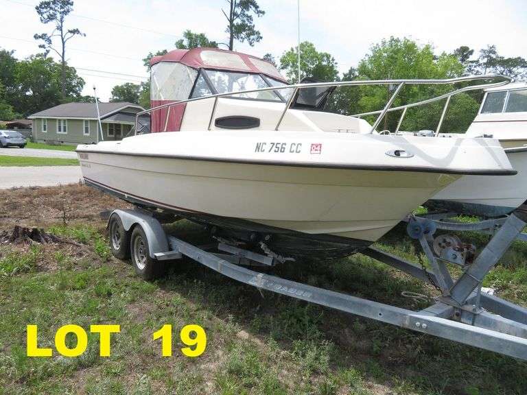 1992  KEY WEST 20 foot with CUDDY CABIN, with electronics, portable toilet, accessories, with 175 HP MARINER Outboard Motor, Hull ID  KWEWA189E292, with EZ LOADER Galvanized Trailer