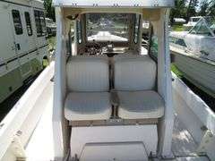 1990  SHAMROCK  PILOT HOUSE, Inboard gasoline engine, boat in very good condition, look at all photos, Hull ID - SHA02775J990, with galvanized boat trailer